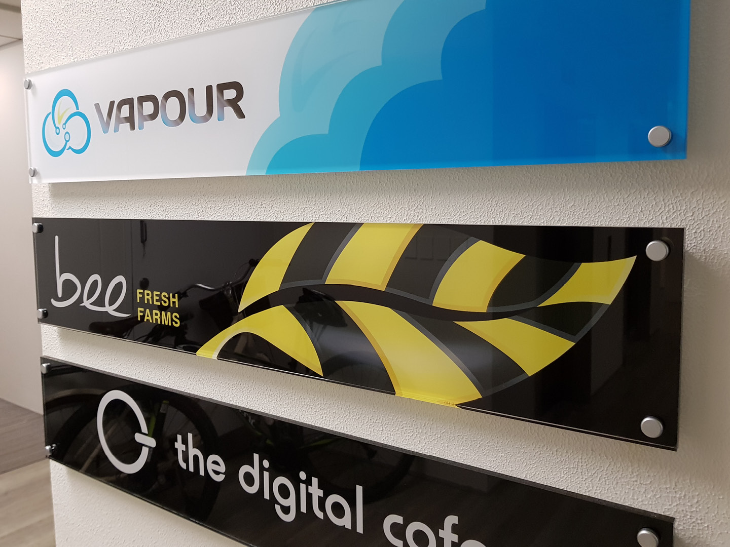Office signage with the new Bee Fresh Farms logo