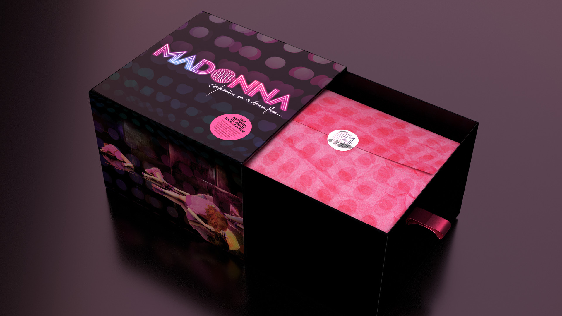 Madonna's "Confessions on a Dance Floor" box set drawer opened to reveal pink paper and a silver sticker