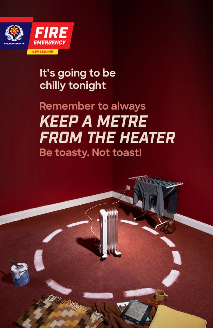 Fire and Emergency NZ 'metre from the heater' fire safety campaign with temperature-specific billboards
