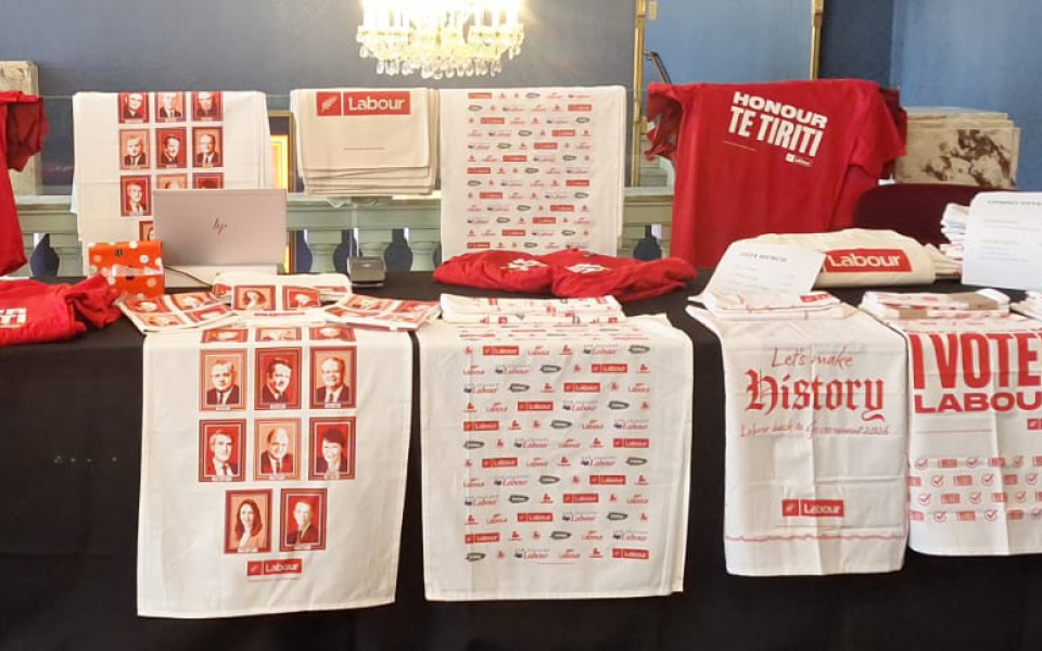 The Labour Party Conference 2024 merchandise table featuring products I designed.