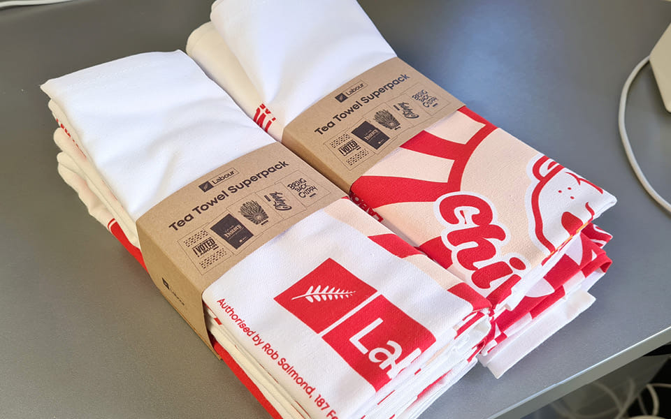 The final design of the Chris Hipkins 'Hot Fresh Chippy' tea towel in a Kiwiana-themed style.