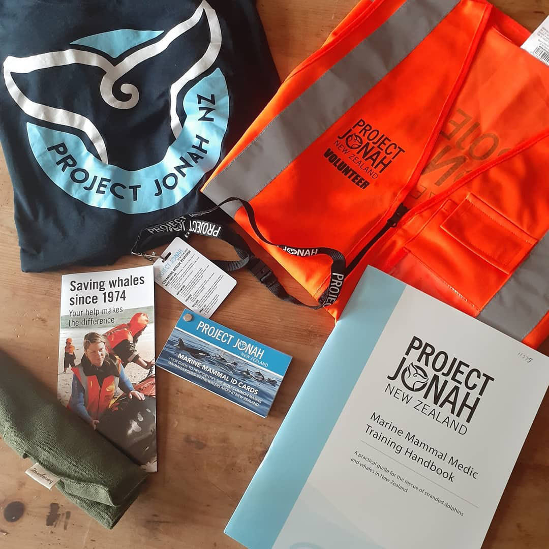 Project Jonah's new logo on t-shirts and stickers