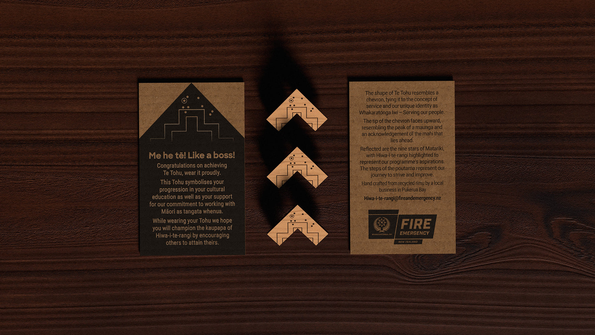 The final tohu, shown in a row of three with the accompanying cards on a wooden table