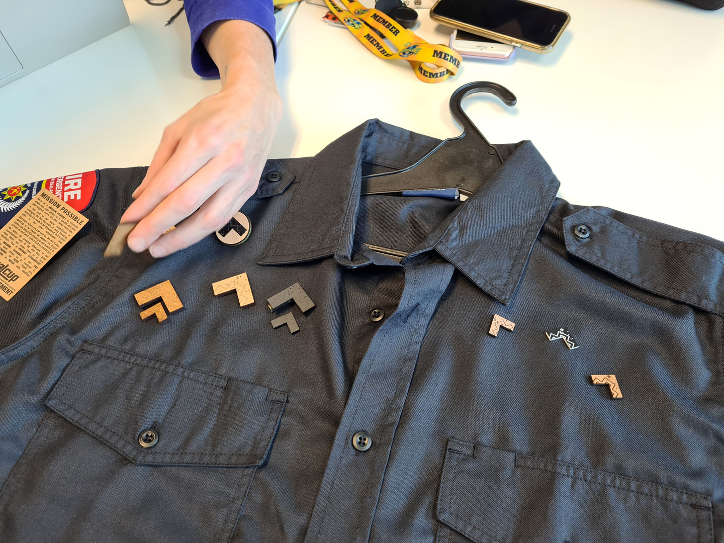 Staff at Fire and Emergency NZ deciding on the tohu's final size and print finishes and how they look on uniforms