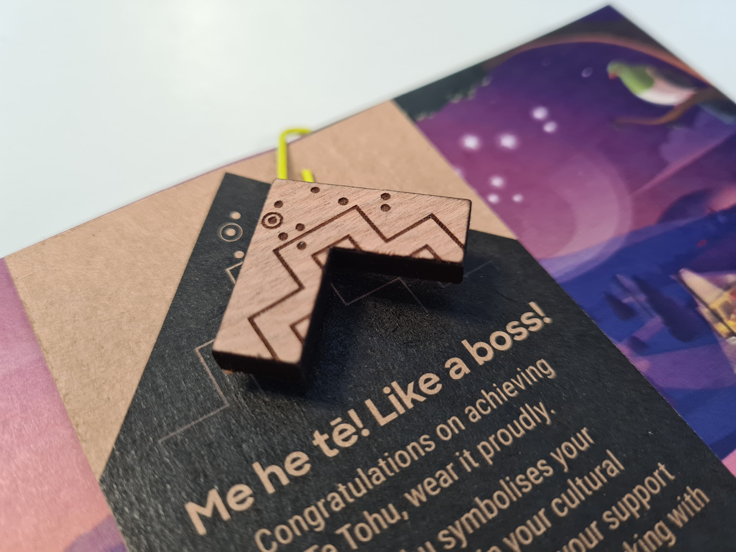 A close-up of the final Fire and Emergency NZ tohu attached to its backing card