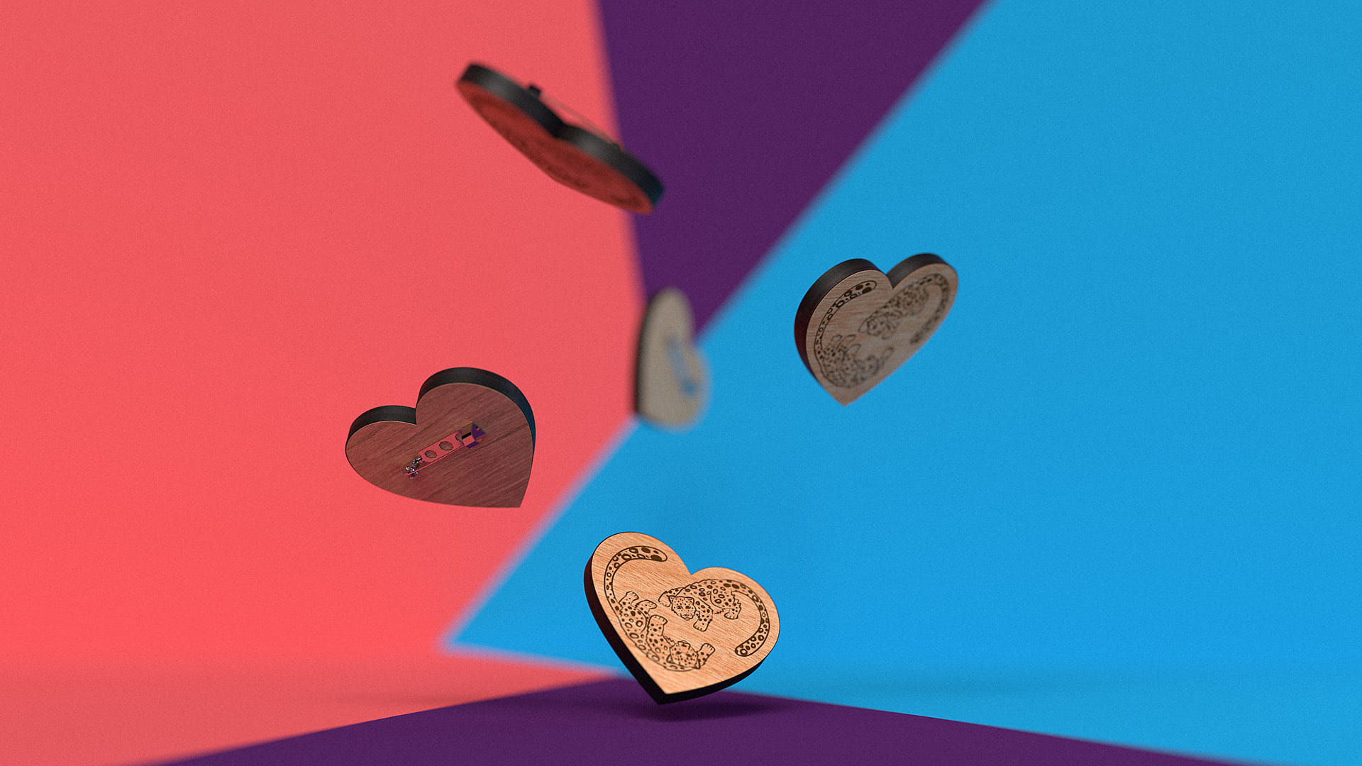 The snow leopard pins for Wellington Zoo, displayed on a coral pink and blue background, designed by Bradley Pratt